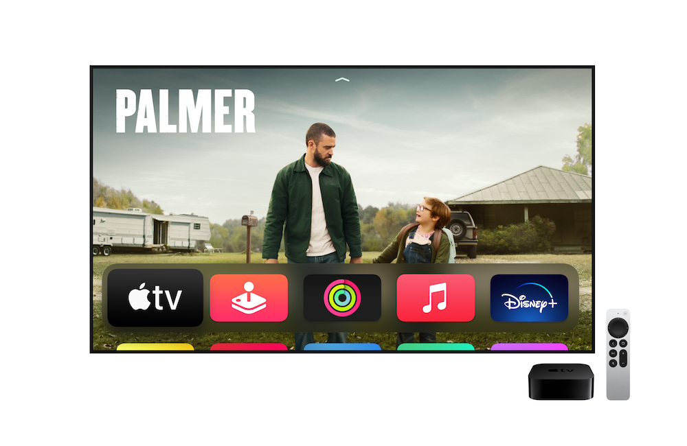 The Apple TV interface showing a TV show publicity shot and available apps below. Apple TV 4K and Siri remote in bottom-right corner.