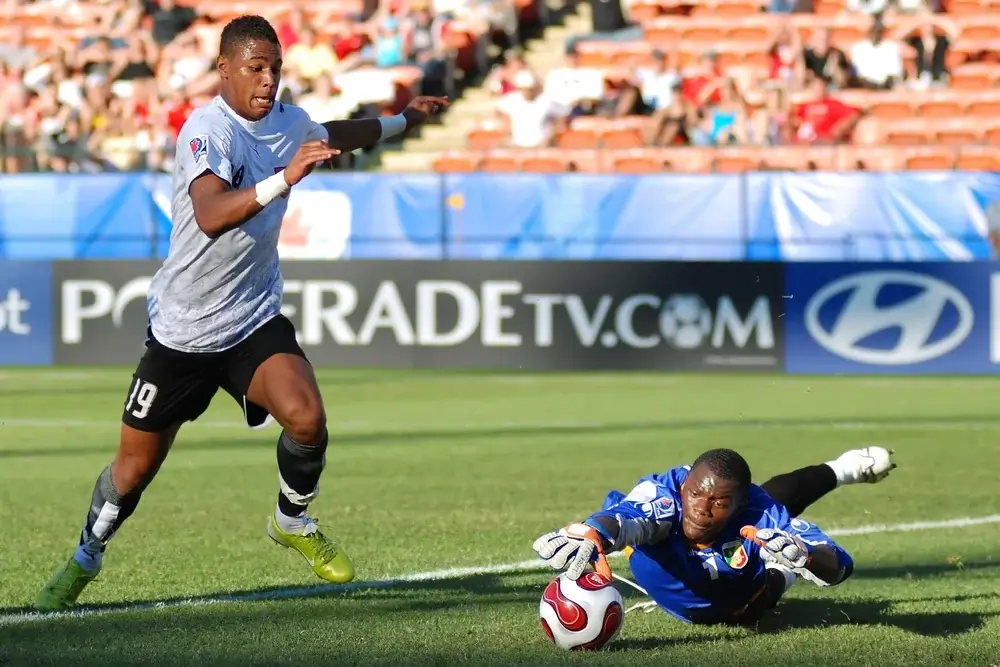 soccer player diving for the ball